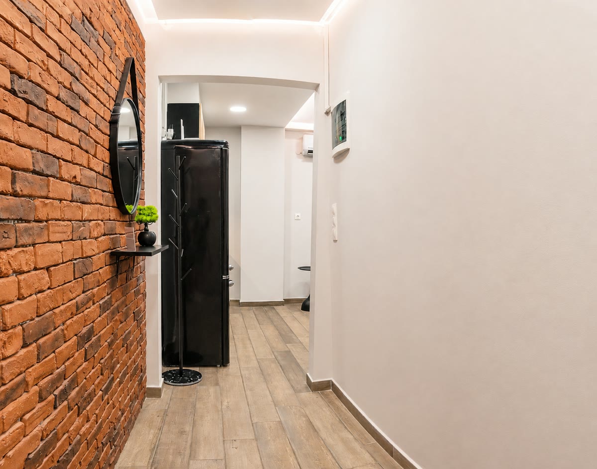 Entrance hallway with exposed brick wall